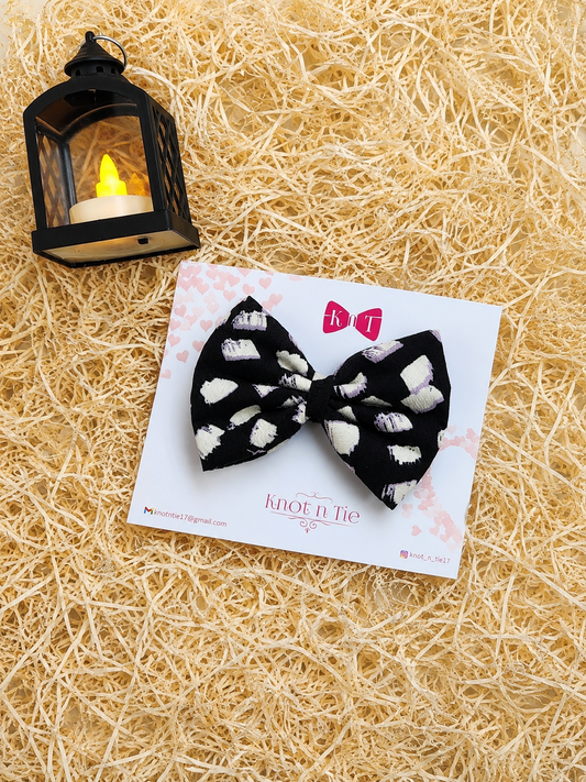 EBONY CHARM ICONIC BOW